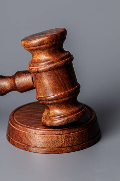 istock Wooden judges gavel on table close up 1298906364
