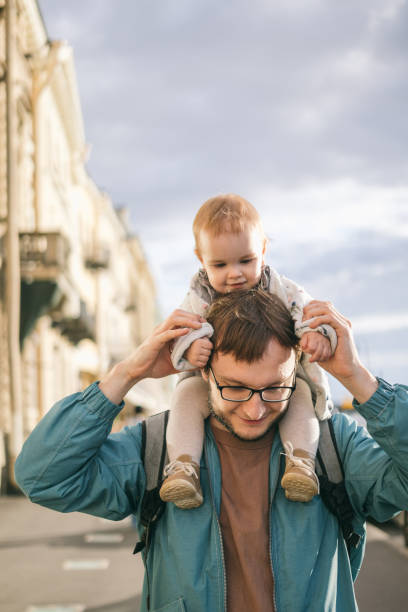 istock Father and one year old baby for a walk 1298906786