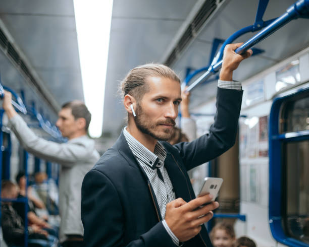 istock young man reading his correspondence in the subway 1298909068