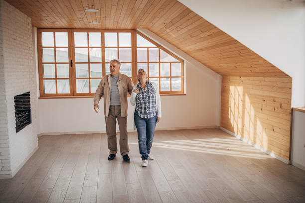 istock Happy senior couple in their empty new apartment 1298909147