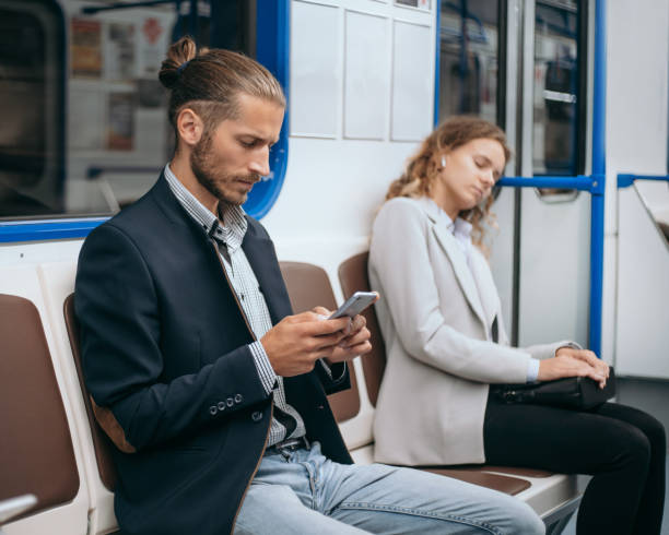 istock passengers sitting on a subway train at a safe distance 1298909221