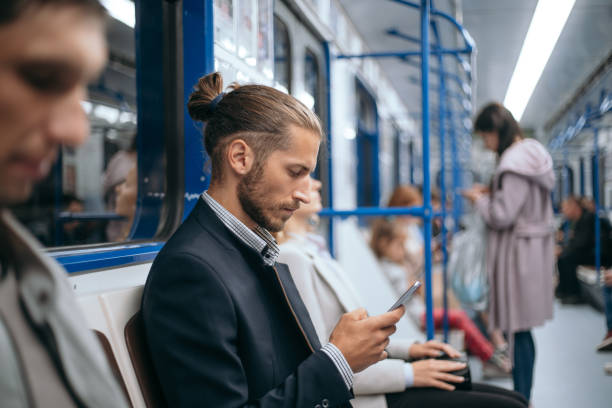istock business man using his smartphone while sitting in the train subway 1298909236