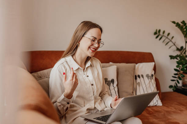 istock Young woman is communicating on video call at home 1298909296