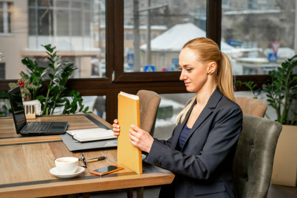 istock Businesswoman with folder with documents 1298915554