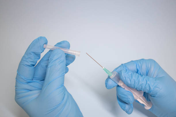 istock Preparing injection with covid-19 vaccine 1298915847
