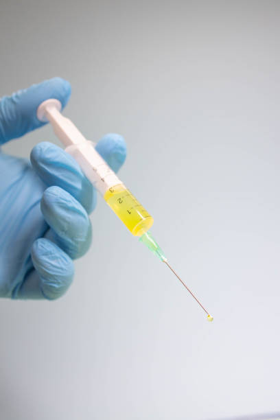 istock Preparing injection with covid-19 vaccine 1298915924
