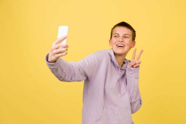 istock Caucasian girl's portrait isolated on yellow studio background with copyspace 1298915943