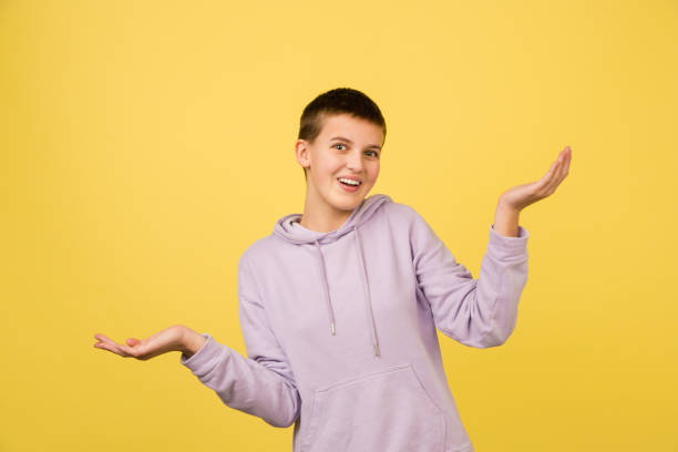 istock Caucasian girl's portrait isolated on yellow studio background with copyspace 1298915964