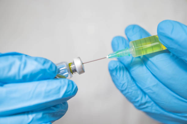 istock Preparing injection with covid-19 vaccine 1298915990