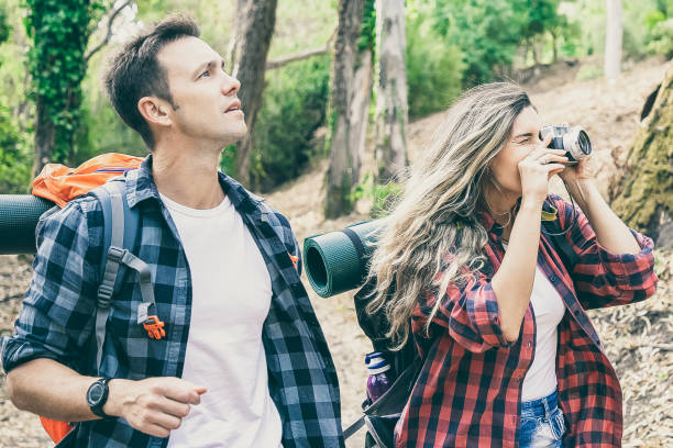 istock Caucasian hikers taking photo, walking or trekking on forest 1298920314