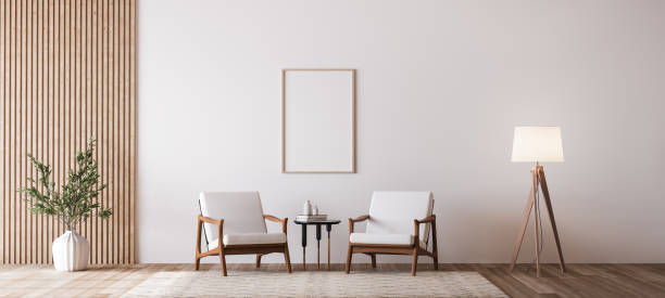 istock Living room design with empty frame mockup, two wooden chairs on white wall 1298922821