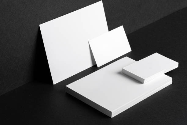 istock White businesscards on black background close up 1298924870