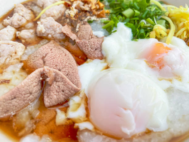 istock Close-up Pork Congee with Soft-boiled eggs is Asian breakfast. Food background 1298926822