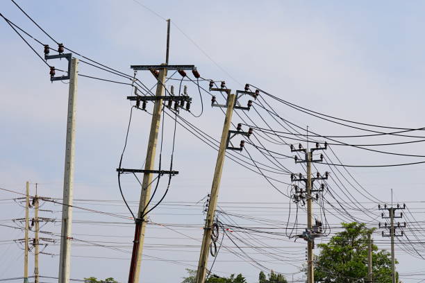 Tangled wires with Electrical poles of high voltage in thailand