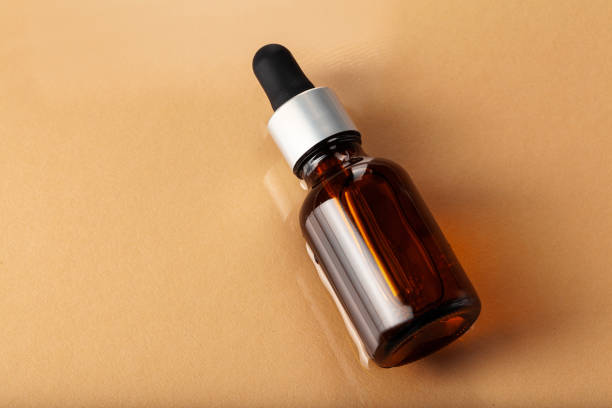 istock Skincare serum bottle on a light beige background 1298929195