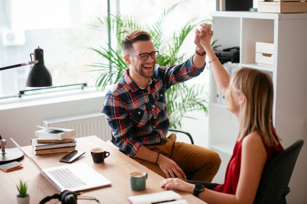 istock Colleagues giving each other high five 1298931443