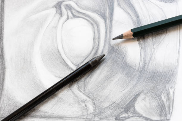 istock two various graphite pencils on drawing of eye 1298931973