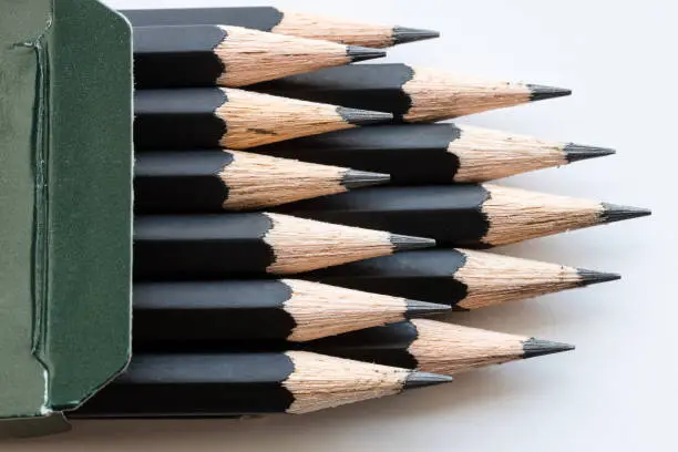 Photo of sharp tips of set of black graphite pencils