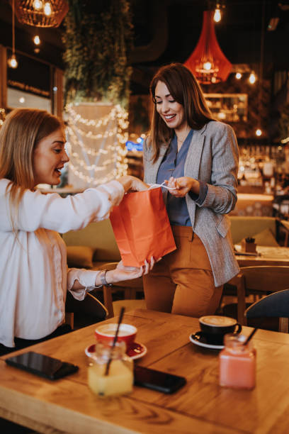 istock Two best friends in coffee bar 1298933942