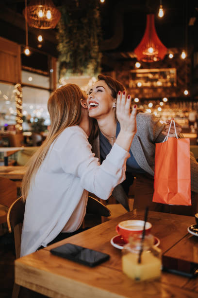 Two best friends in coffee bar