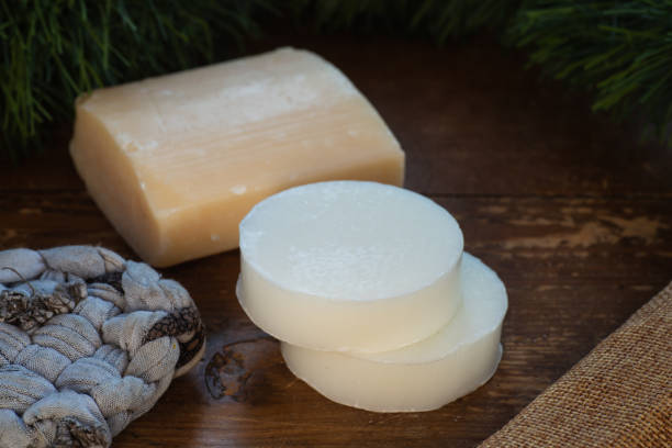 istock Donkey milk soap, on rustic background.,with tawashi. 1298935329