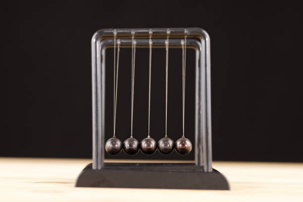 istock Newton cradle balance balls on the table 1298935357