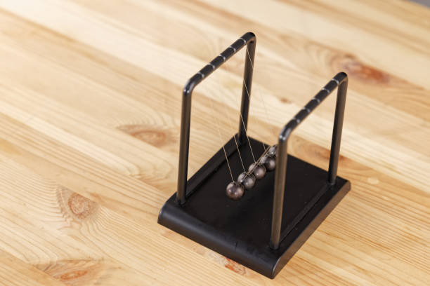 istock Newton cradle balance balls on the table 1298935361