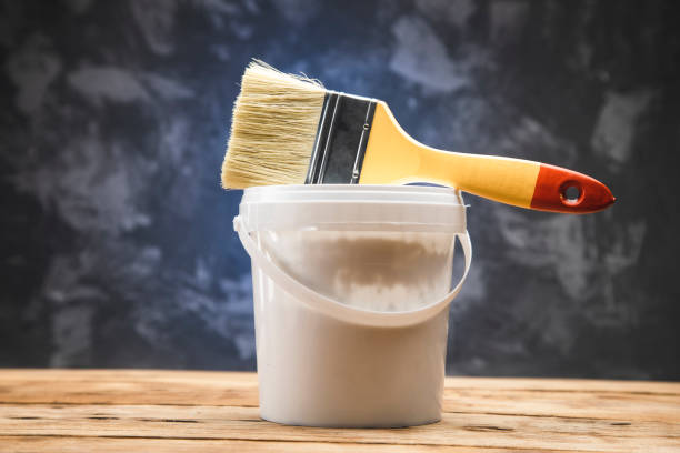 istock brush on the paint bowl 1298936620