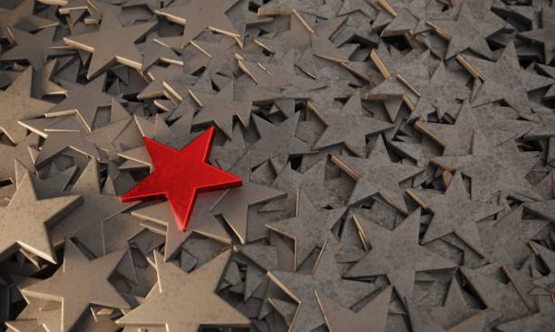 istock Red Star Standing Out From The Crowd 1298937469