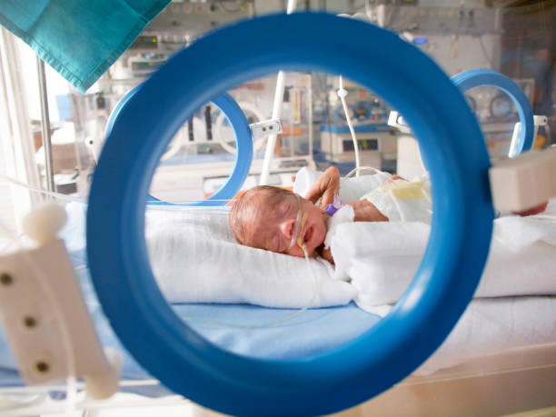 Preterm baby in NICU Baby girl born at 6th month of pregnancy, weighting only 650g at a time in NICU. Authentic imagery. incubator stock pictures, royalty-free photos & images