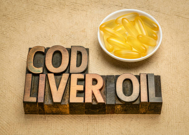 タラ肝油カプセル木材型レタリング - fish oil vitamin pill cod liver oil nutritional supplement ストックフォトと画像