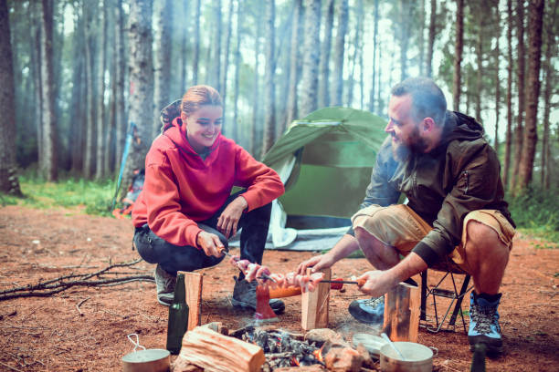 istock Skewer Barbecue Dinner In Forest For Cute Couple 1298945599