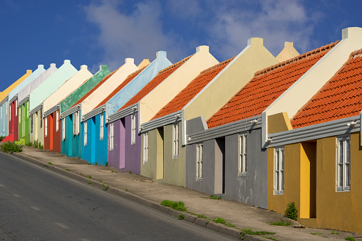 Road lined with colored Caribbean houses in Willemstad.