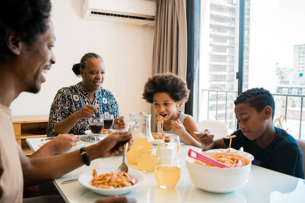istock Family having lunch together at home. 1298947244