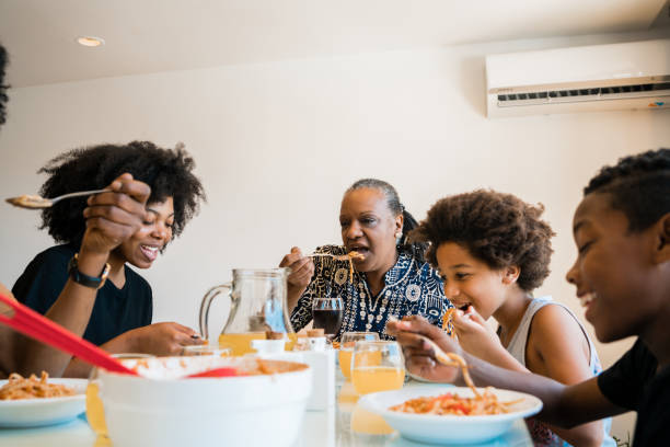 istock Family having lunch together at home. 1298947253