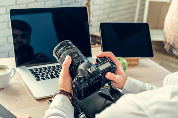 istock Working table of a photographer close up 1298947998
