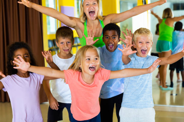 istock Positive children in dance studio smiling and having fun 1298949197