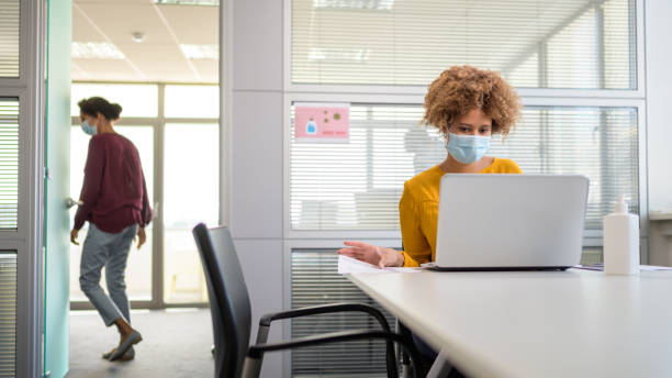 istock Businesswoman working on laptop in office 1298950865