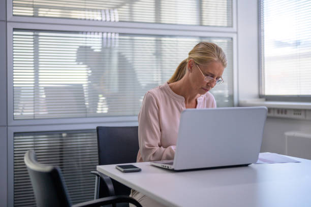 istock Businesswoman working in office 1298954469