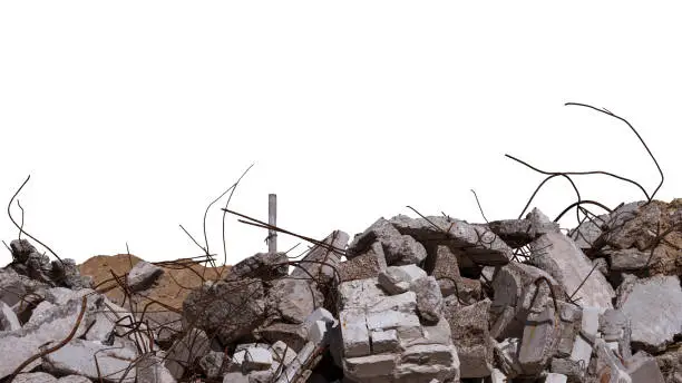 Photo of Concrete remains of a ruined building with exposed rebar, isolated on a white background. Background