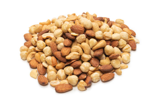 istock Mix of nuts isolated on white background. Top view. 1298956660