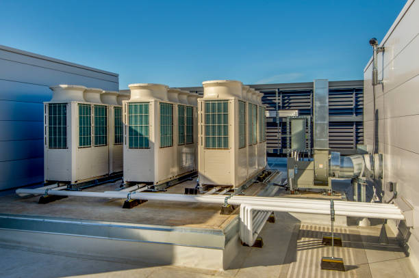Rooftop HVAC Units Variable refrigerant volume HVAC units in a rooftop installation. chiller hvac equipment photos stock pictures, royalty-free photos & images