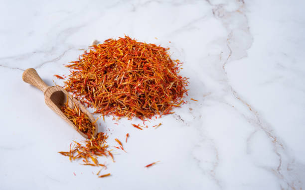 aroma oriental spice saffron on a marble table aroma oriental spice saffron on a marble table. Copy space substitute for saffron stock pictures, royalty-free photos & images