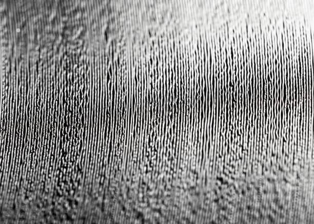 The tracks and individual grooves of a record in close-up.