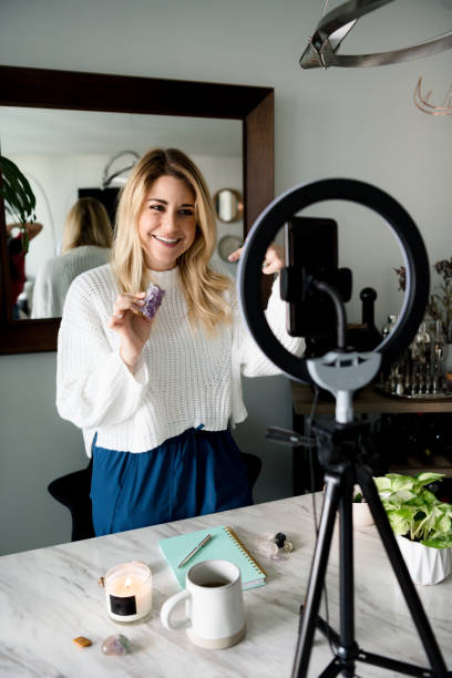 istock Woman vloggin with cellphone about stones 1298959099