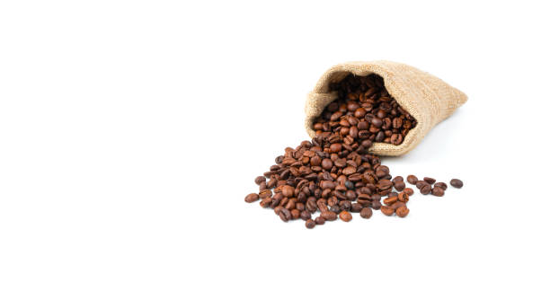 istock Spilling coffee beans from a linen bag isolated on a white background 1298959115