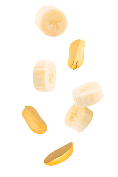 istock Set of falling peanut isolated on white background 1298960400