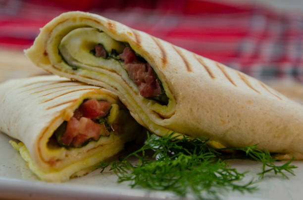 istock Pancake stuffed with meat cut in half, with herbs 1298960464