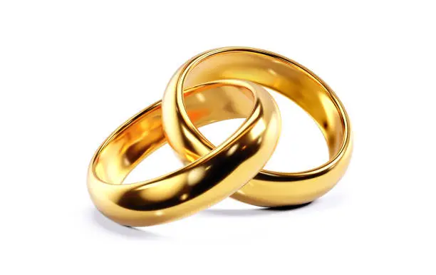 A pair of golden wedding rings. 3D render isolated on white background