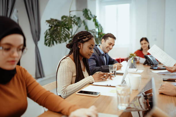 istock Multi ethnic business people working in shared office after reopening 1298961922